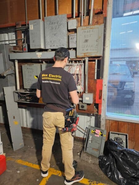Max Electric electrician working on panel and remodel electrical wiring