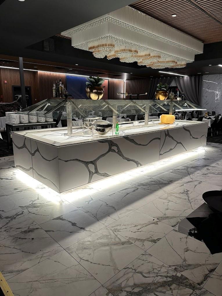 Custom lighting fixture installation in upscale interior