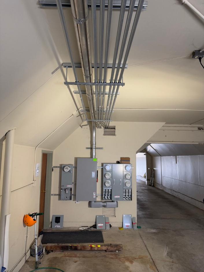 Multi-unit service upgrade with new electrical equipment installed in building
