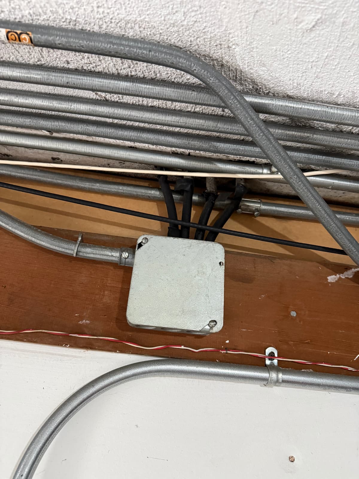 Upgraded junction box and conduit wiring in an older home
