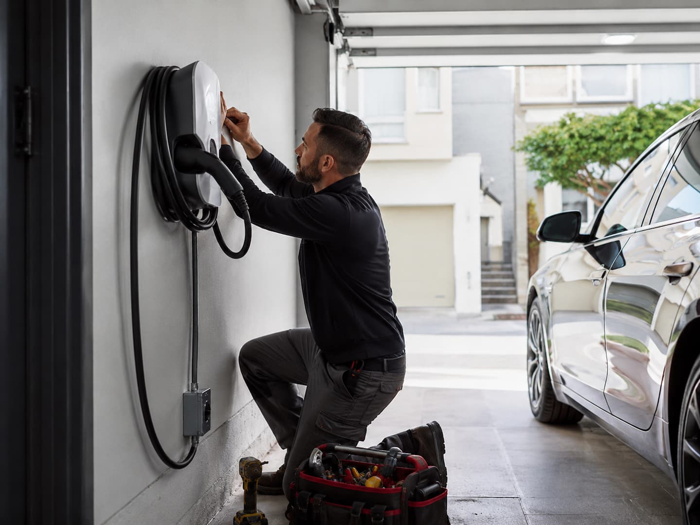 Electrician installing a home EV charger in San Francisco