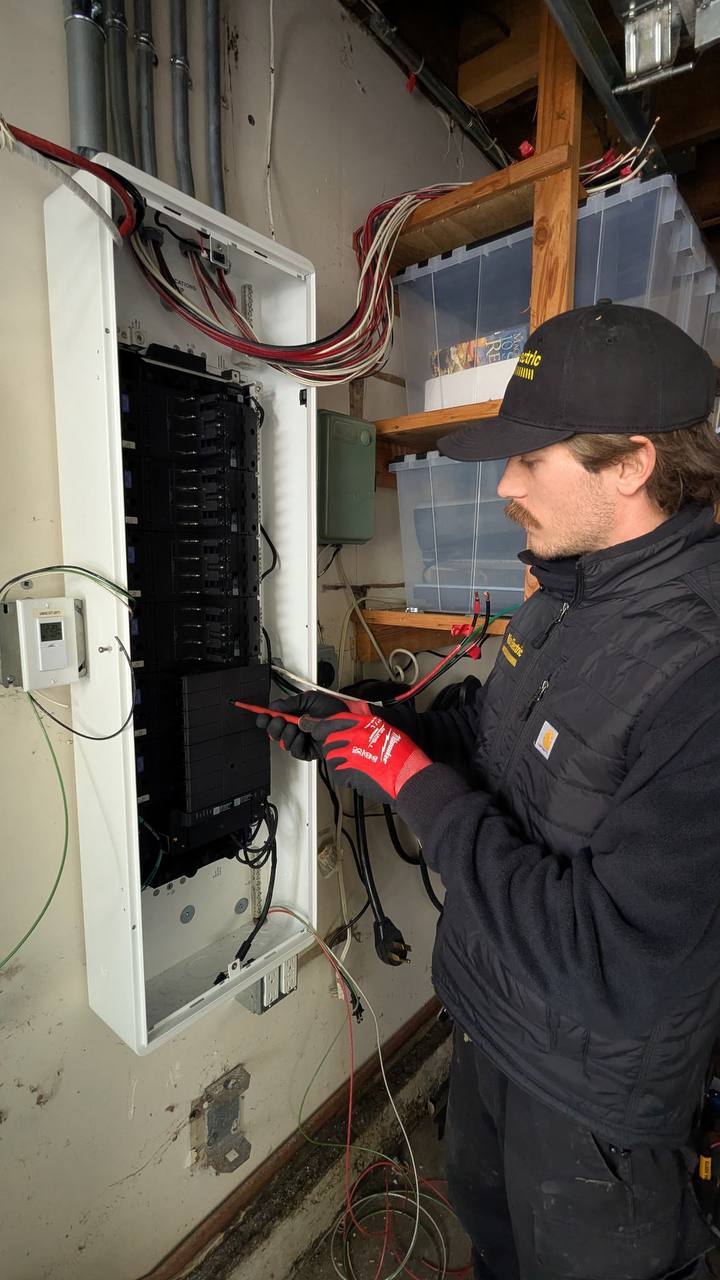 Max Electric electrician troubleshooting a residential electrical panel in San Francisco