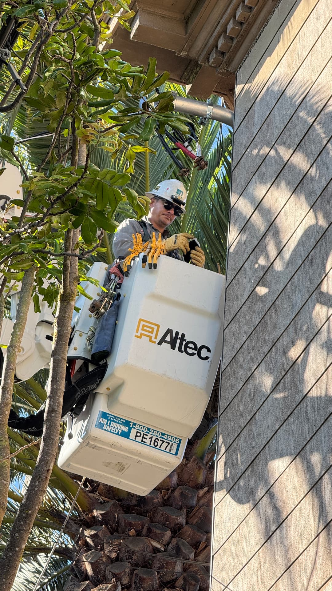 Bucket truck overhead service installation near multifamily building