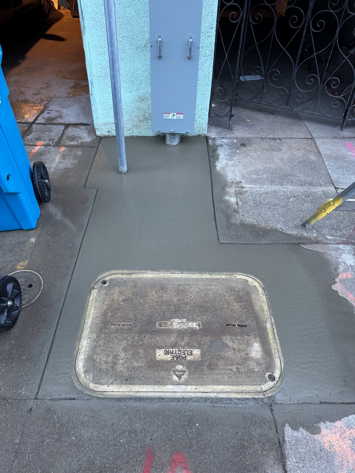 Completed secondary service box and sidewalk repair after utility work