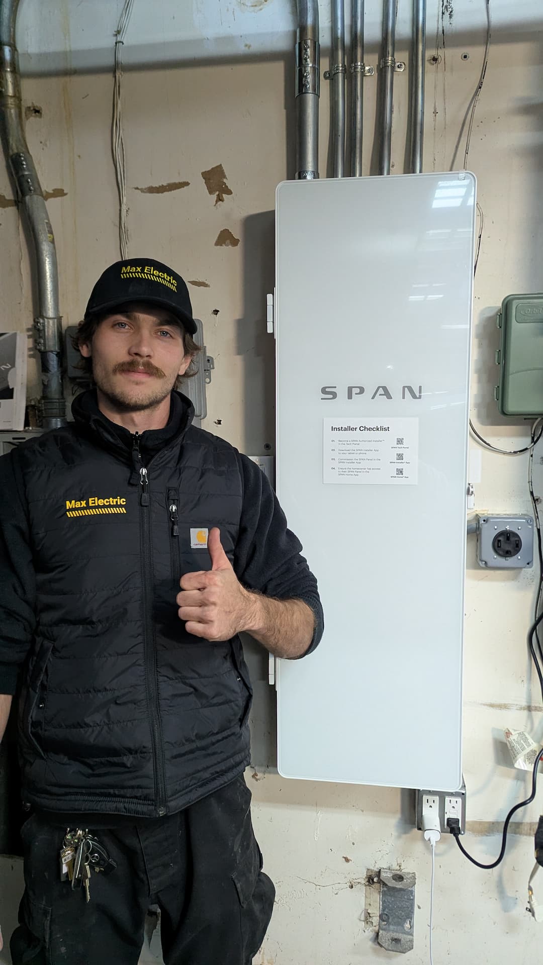 Electrician after finished SPAN Smart Panel installation
