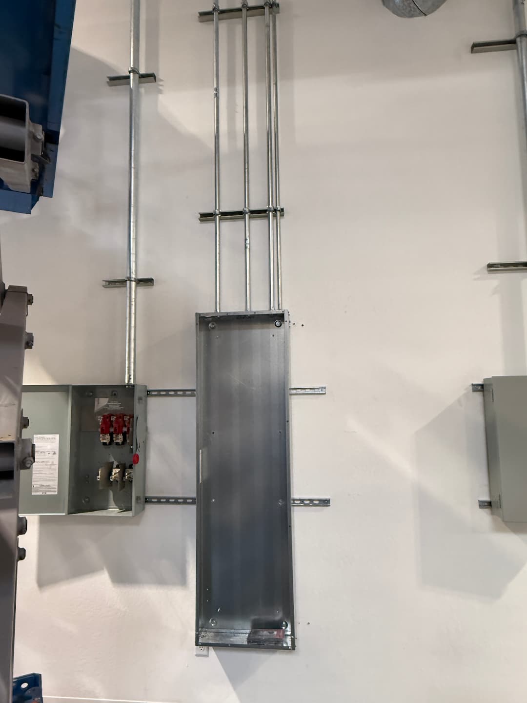 Industrial distribution panels and conduit installation