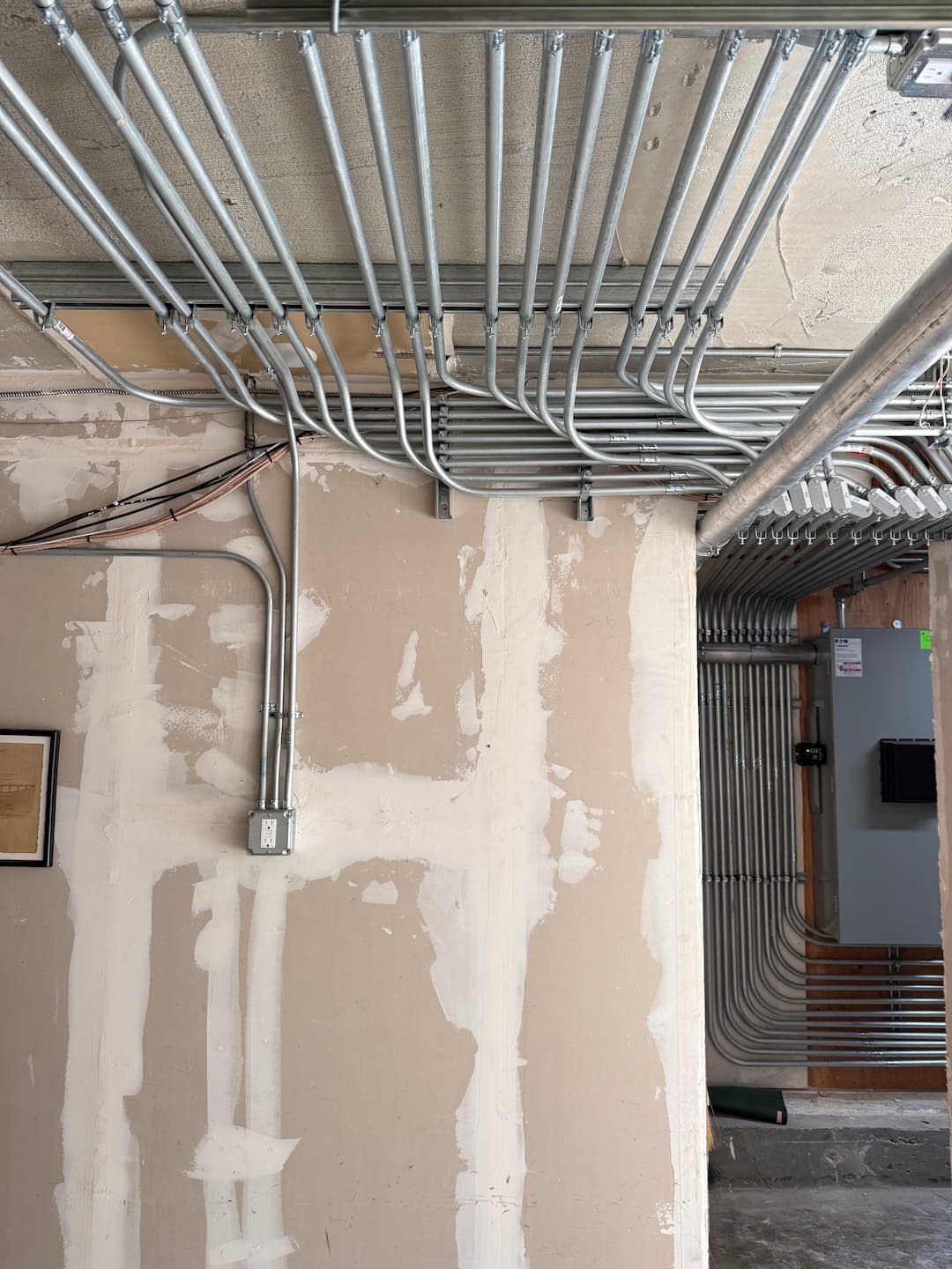 Limited space conduit routing on Gough Street apartment building