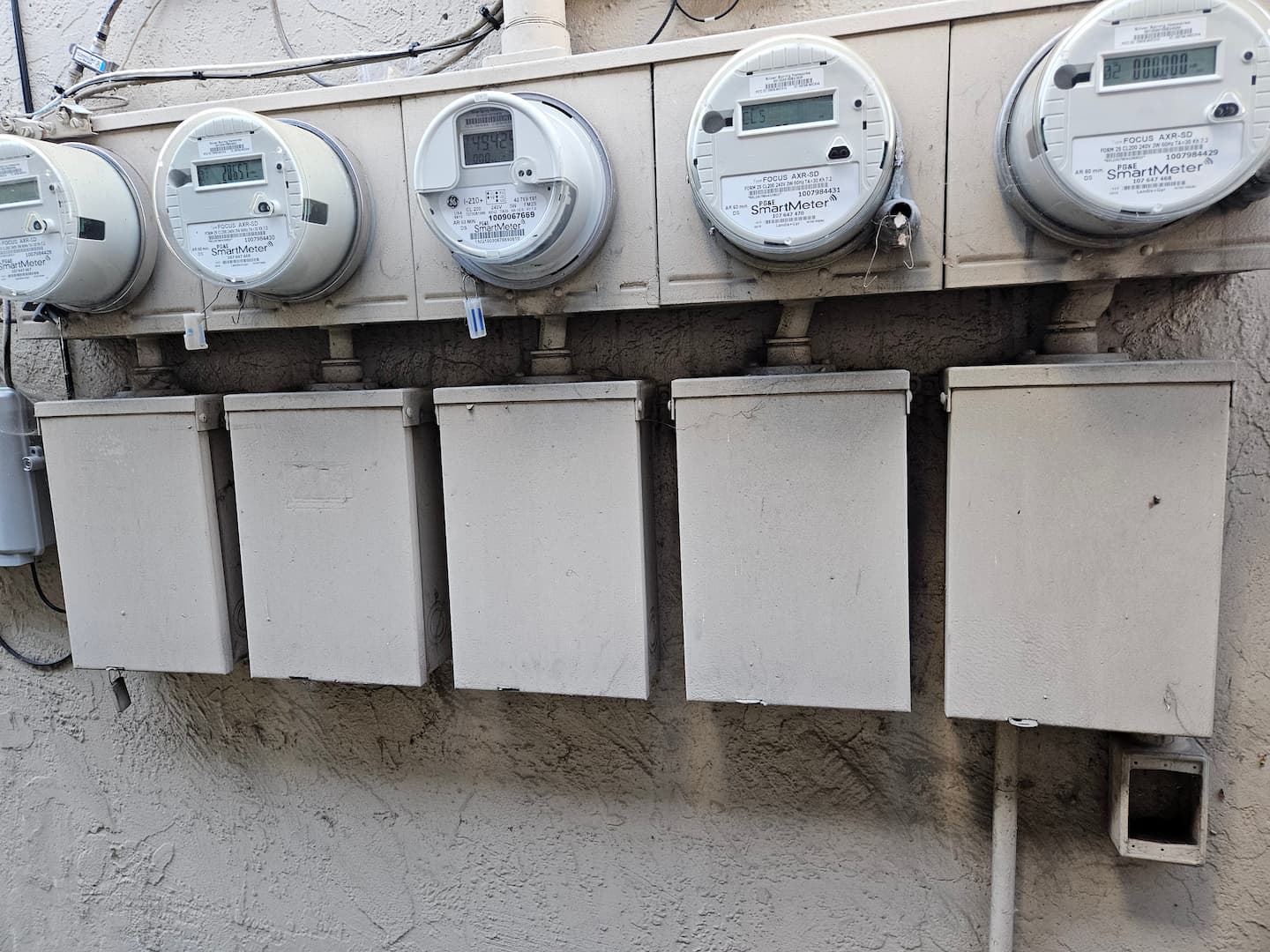 Old multi-unit electrical panels before replacement in Oakland