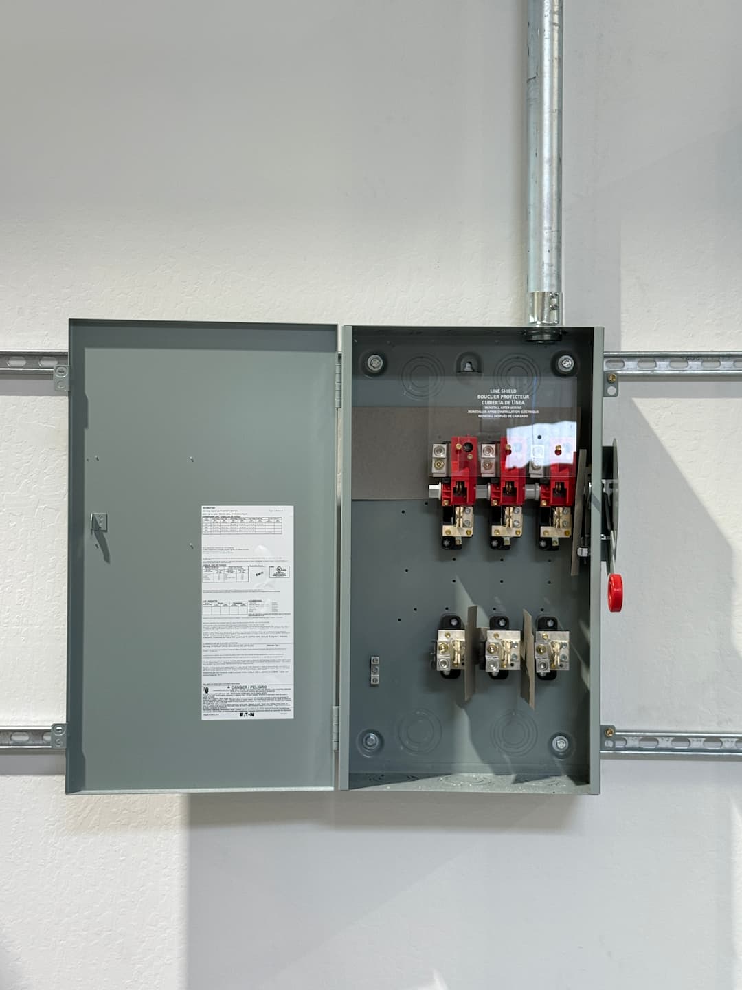 Open industrial electrical panel inspection