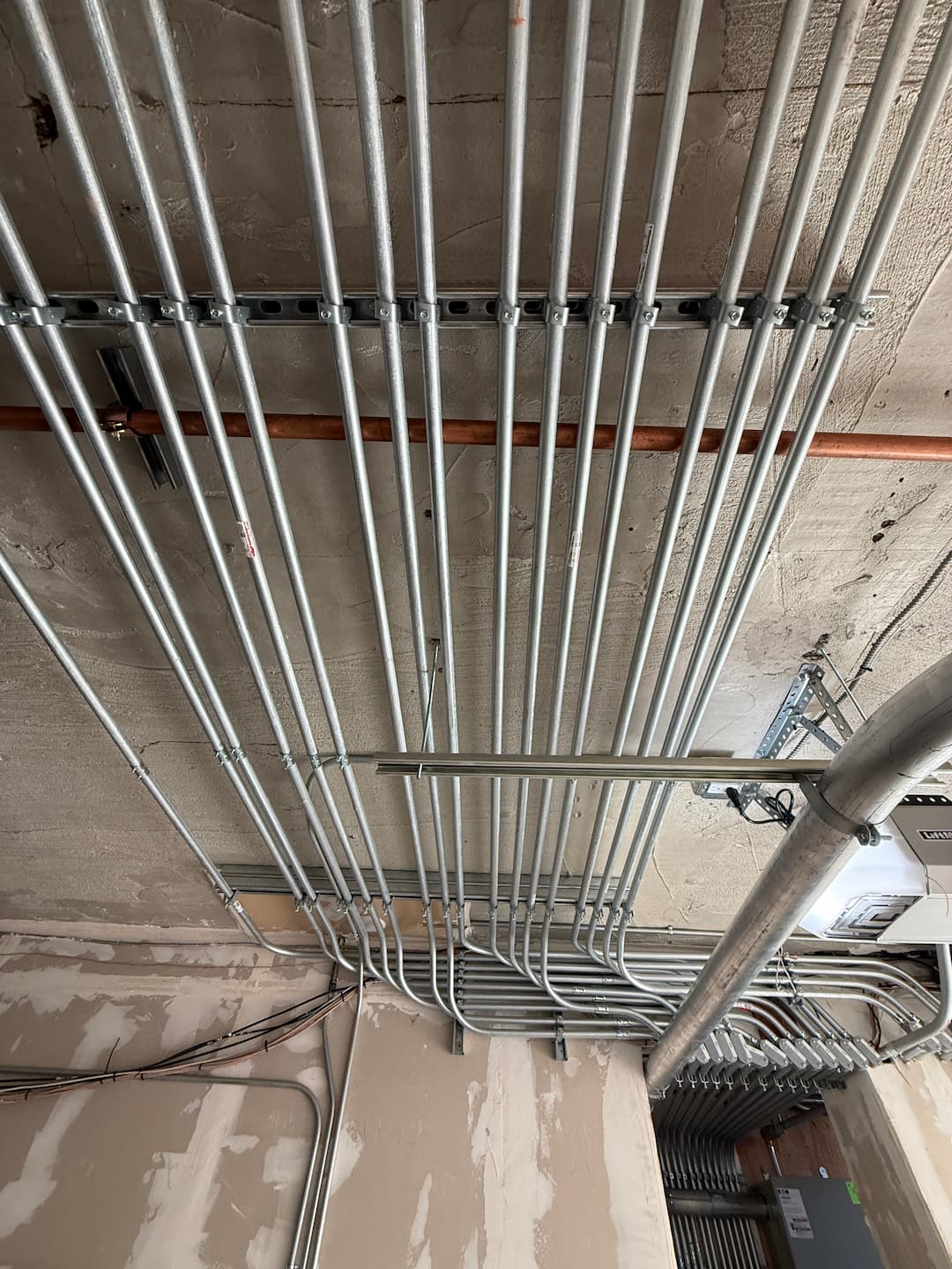 Overhead conduit routing for 16-unit apartment building