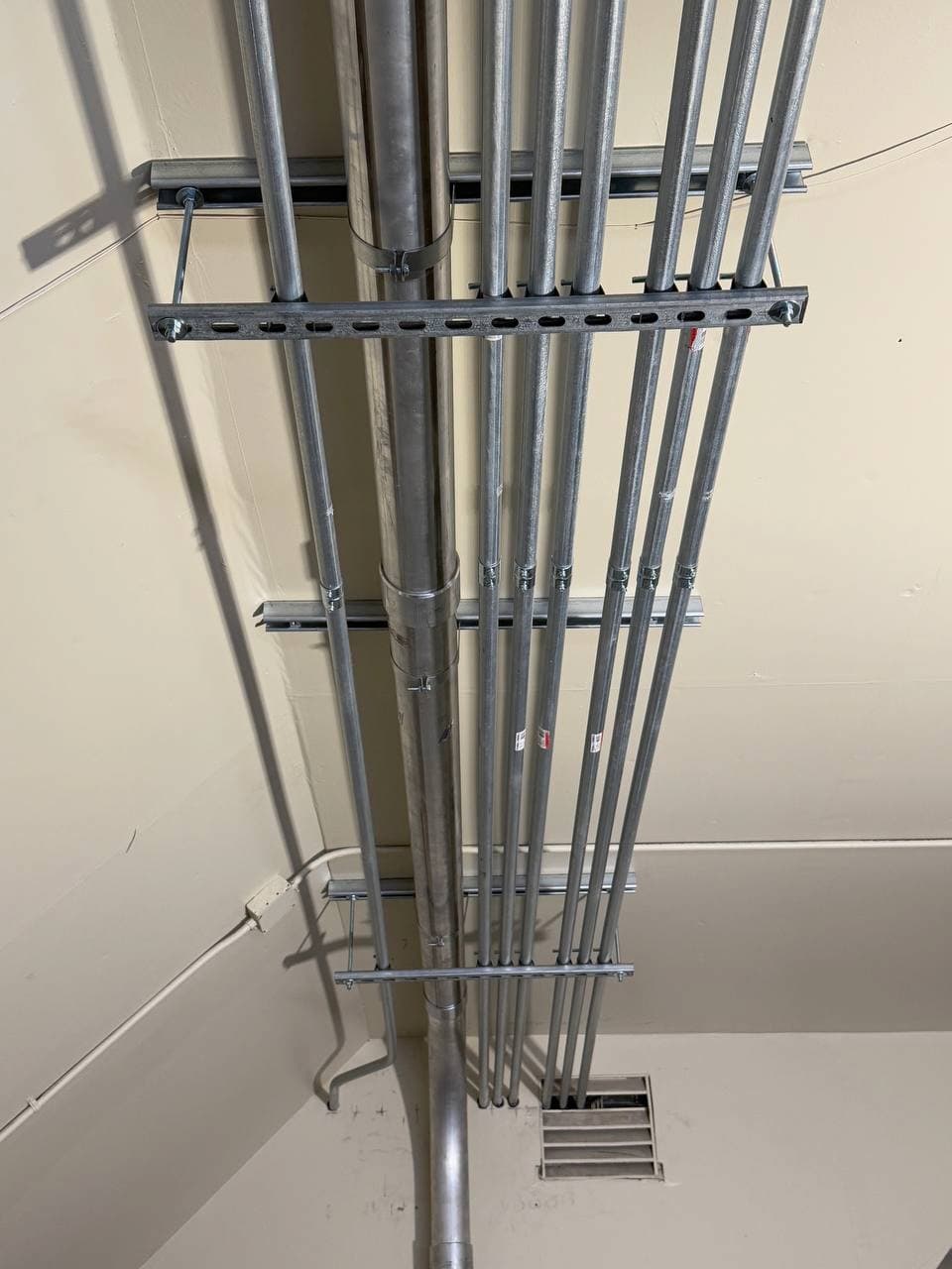 Overhead conduit routing for six-unit building