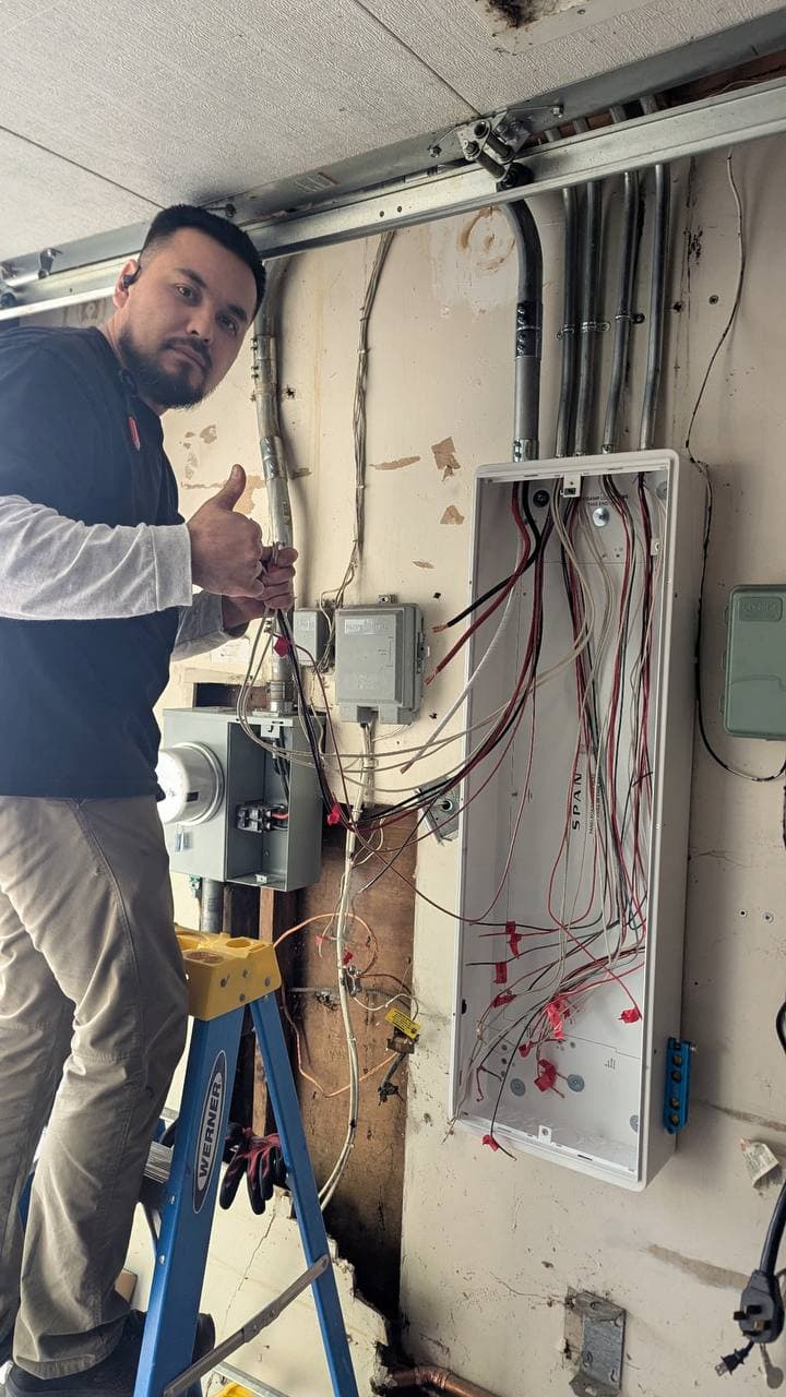 Electrician preparing wiring during SPAN Smart Panel installation