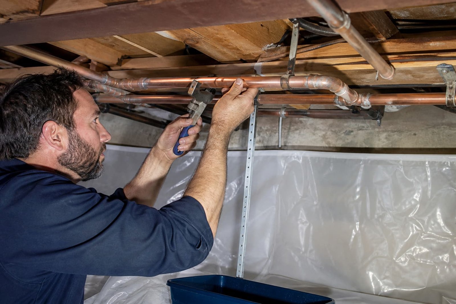 Plumber preparing for emergency burst pipe repair in san francisco