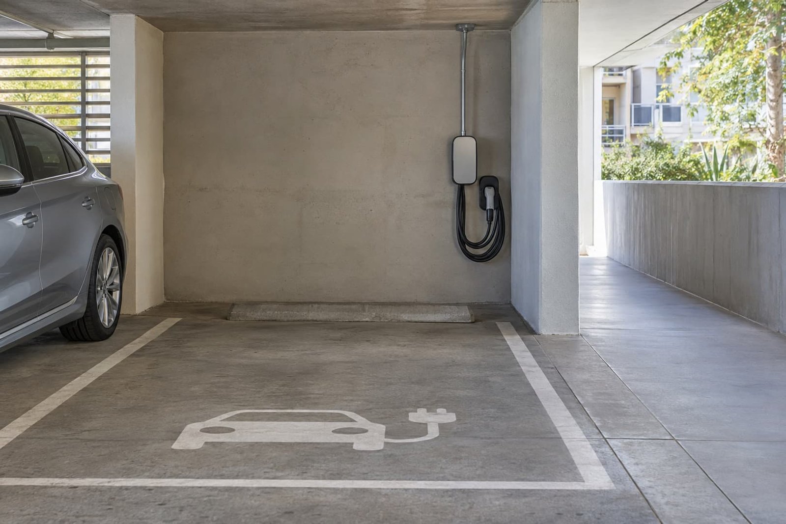 Charging equipment installed beside a shared building parking space