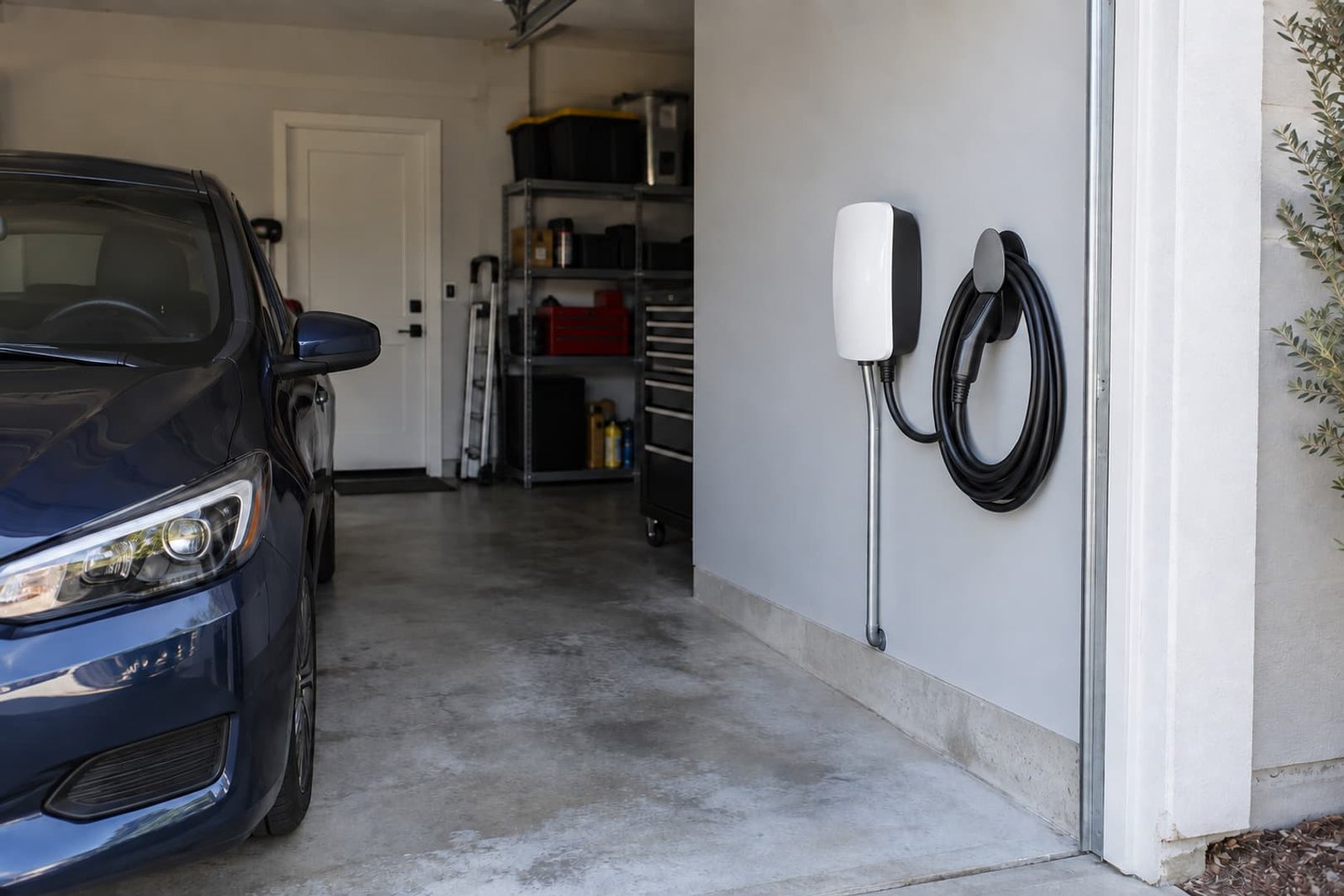 EV charging equipment positioned beside a home parking space