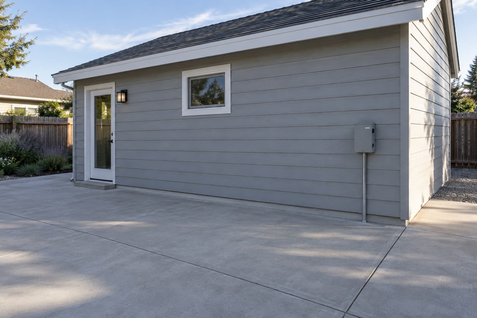Detached workroom with accessible exterior electrical equipment