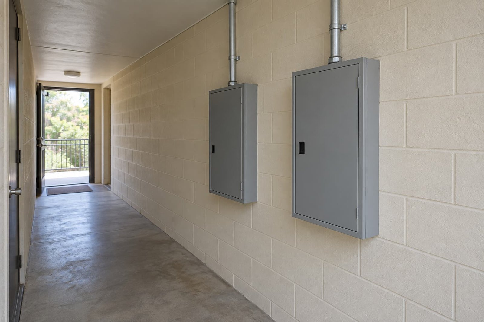 Closed electrical equipment in a shared building service corridor