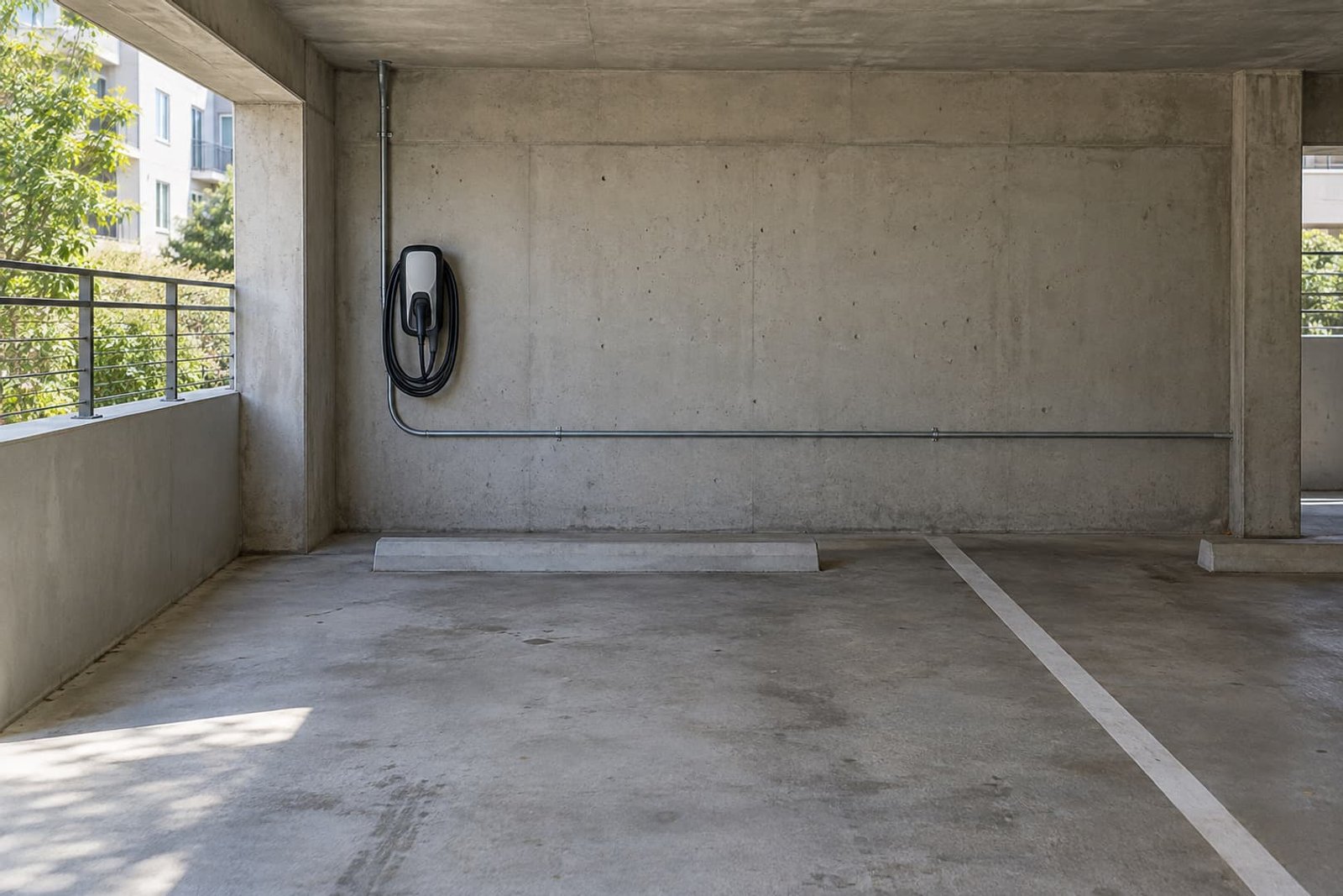 EV charger mounted beside a covered parking space