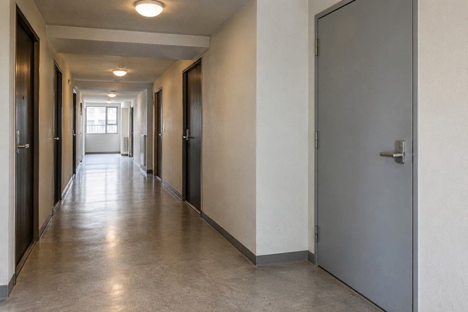 Apartment corridor with a closed service-room entrance